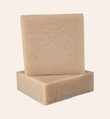 Aloe vera soap with a wooden spoon on a white background, featuring the Aryabhoomi Naturals brand.